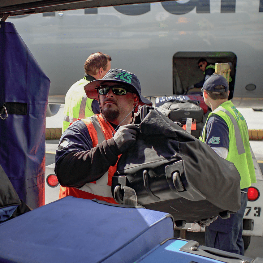 terminal worker unloading bags