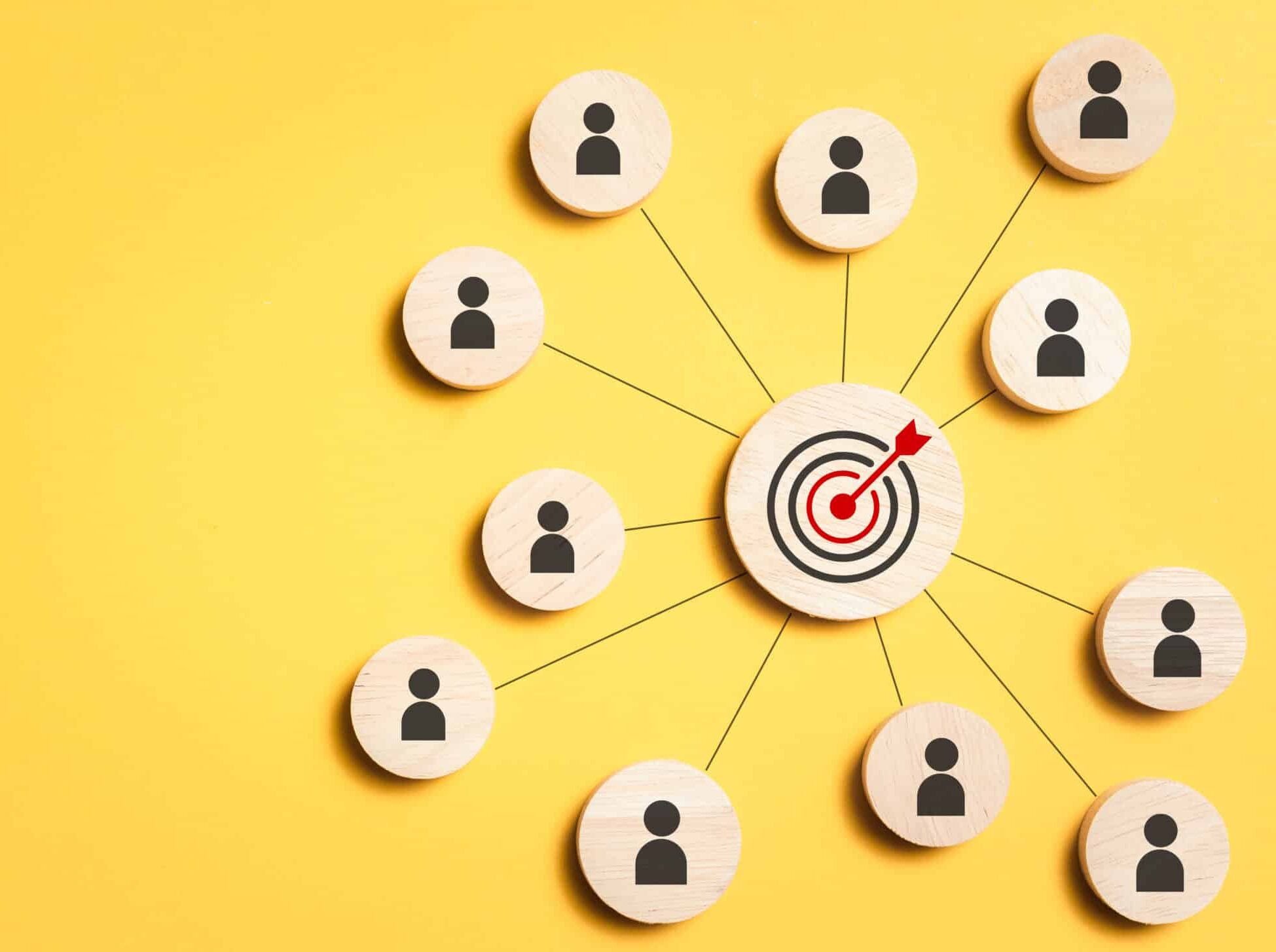 Target symbol connected to user icons representing social media marketing audience targeting.