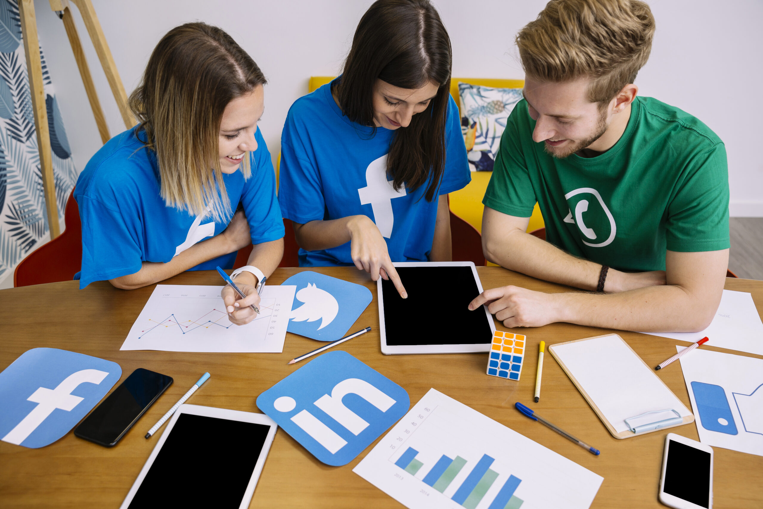 Marketing team planning a content creation system with platform-specific assets for social media distribution strategy 